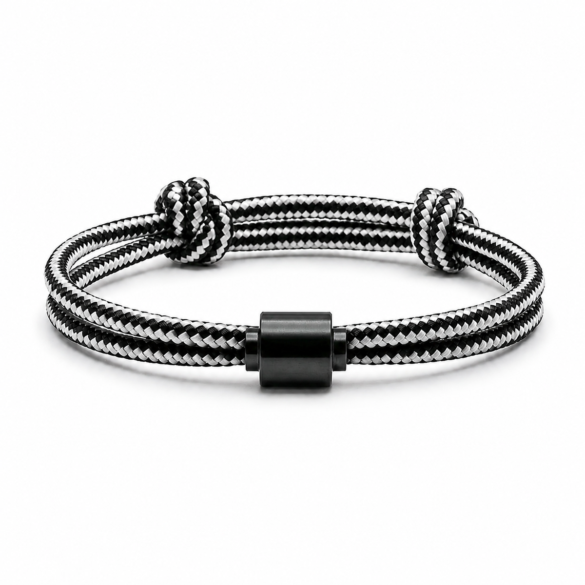 Tadblu EVER NOBLE herenarmband met zwart-wit gestreept koord, zwarte cilindervormige ashouder en verstelbare knoopsluiting.