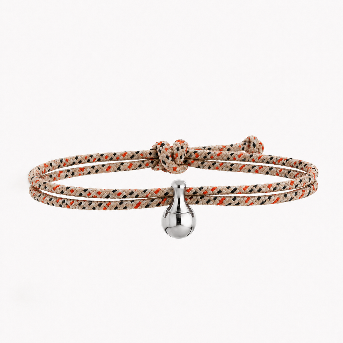Tadblu EVER CLOSE damesarmband met zand-oranje-zwart patroon koord, edelstalen traanvormige ashouder en verstelbare knoopsluiting.