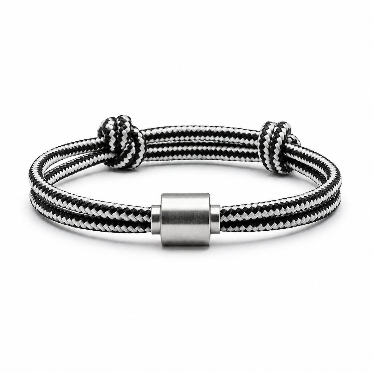 Tadblu EVER NOBLE herenarmband met zwart-wit gestreept koord, edelstalen cilindervormige ashouder en verstelbare knoopsluiting.